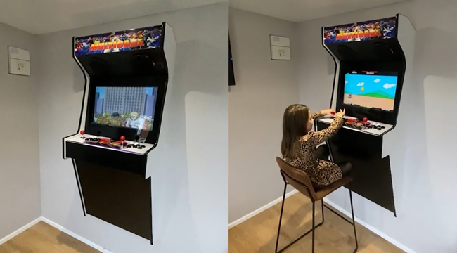Ông bố lắp máy chơi game lên tường để chiều lòng con gái